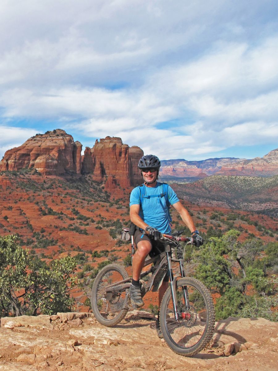 man riding bike in the arizona desert